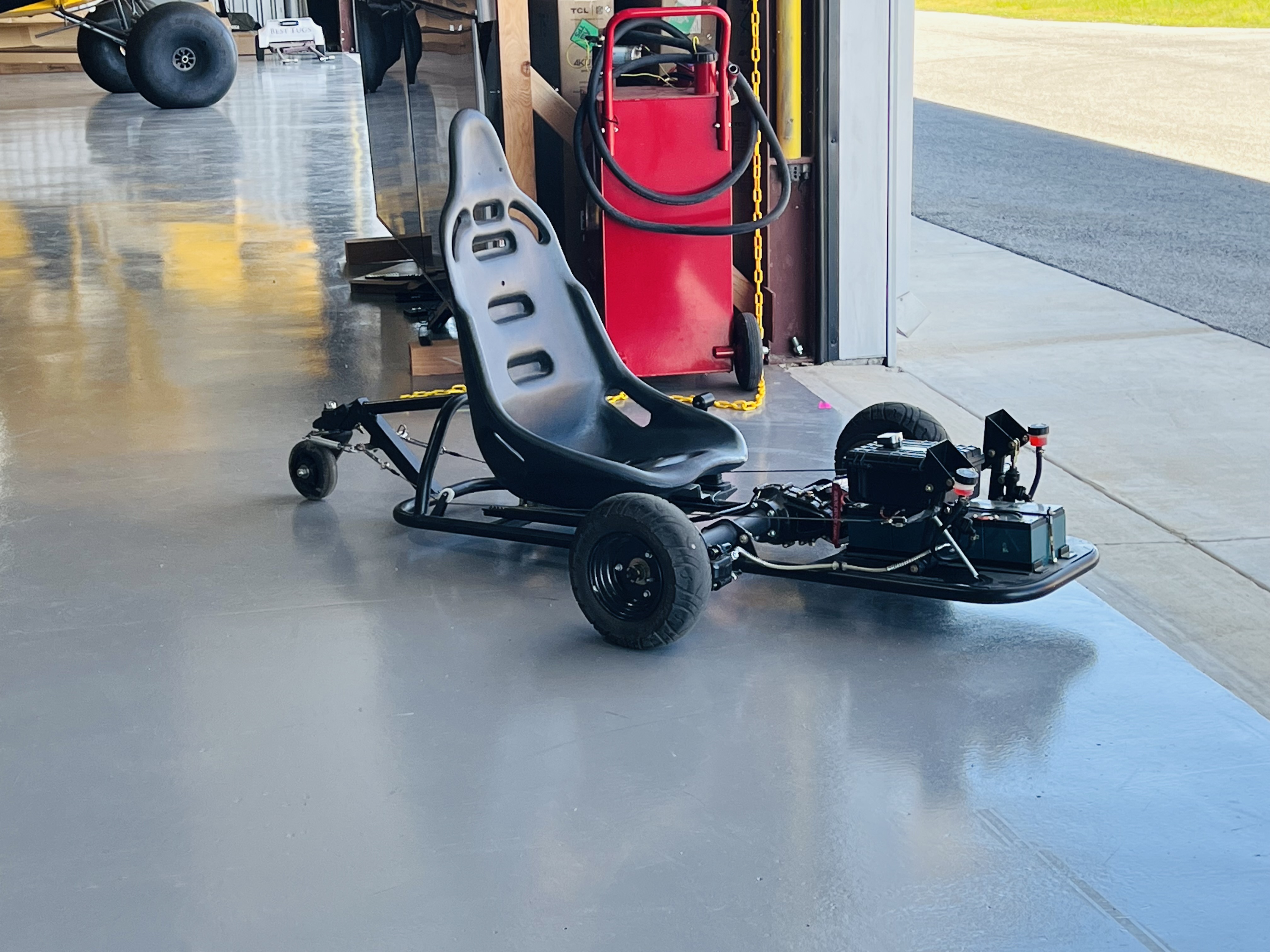 Carbon Cub on floats in the TacAero hangar